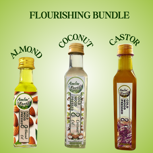 "Flourishing Bundle by Amlin Earth featuring almond, coconut, and castor cold wood pressed oils for nourishing body, hair, and skin."