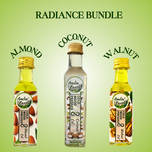 Radiance Bundle by Amlin Earth featuring almond, coconut, and walnut cold wood pressed oils in bottles.